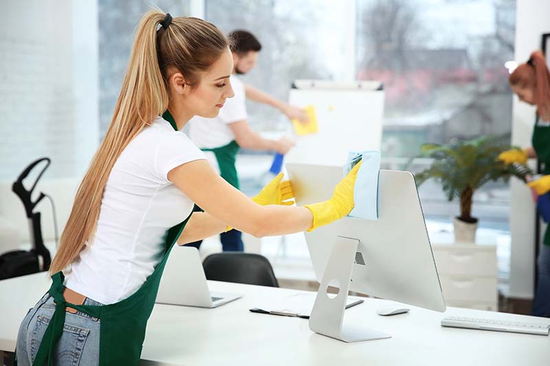 Young Woman Professionally Cleaning Office