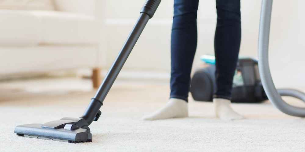 Vacuum Carpeting to Remove Dust